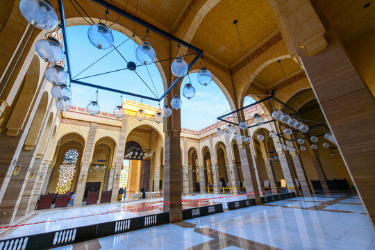 The interior courtyard and porticos of the Ahmed Al-Fateh Grand Mosque, on of the largest mosques in the world, in Manama Bahrain.