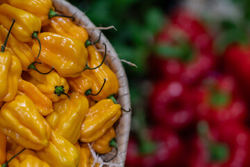 spicy yellow peppers inside a basket
