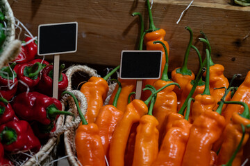 yellow and red peppers with signs