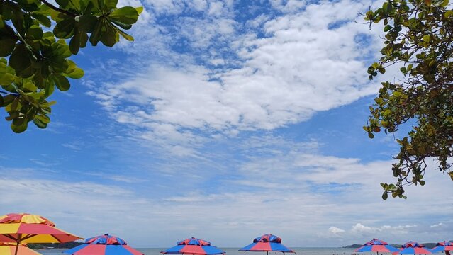 Beautiful blue sky on the beach with umbrellas