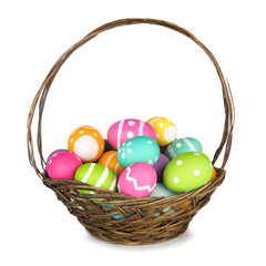 Fototapeta na wymiar Easter basket filled with colorful hand painted Easter Eggs isolated on a white background