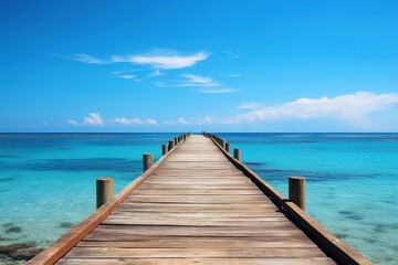 Obraz premium Wooden jetty over the clean blue sea or ocean on sunny summer day