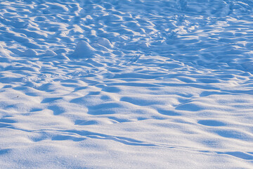 Fresh, snowy surface in sunny weather during the day.