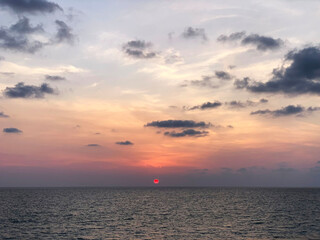 The sea in the embrace of the sunset: an incredible moment when sky and water merge into one. The...