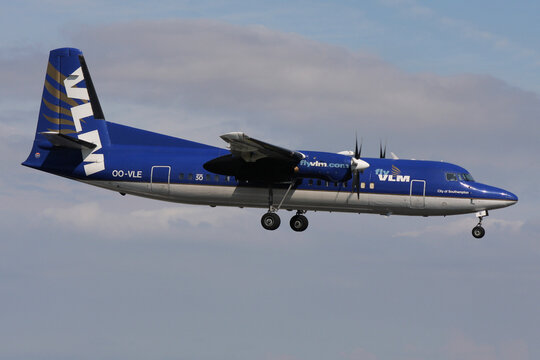 Schiphol, Netherlands - July 29, 2008: Belgian VLM Fokker 50 with registration OO-VLE on final for Amsterdam Airport Schiphol
