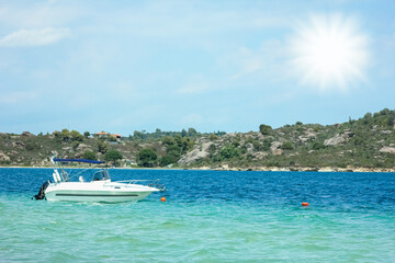 A beautiful boat floating on the background of the sea silhouette