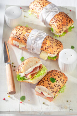 Fresh sandwich with camembert, prosciutto and mayonnaise.
