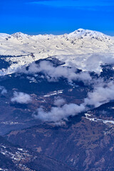 Fototapeta premium Breathtaking beautiful panoramic view on Snow Alps - snow-capped winter mountain peaks around French Alps mountains, The Three Valleys: Courchevel, Val Thorens, Meribel (Les Trois Vallees), France