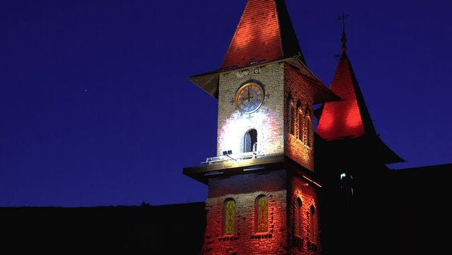 clock tower in the old castle at night