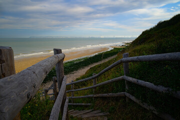 path with wooden border going down to Villerville beach in Normandy