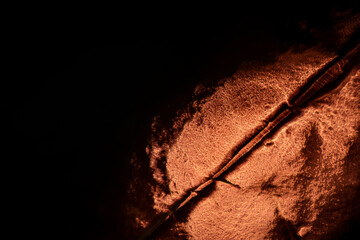 Abstract golden coffee bean on a black background