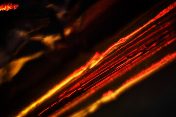 Fiery red lines on a black bg, abstract background
