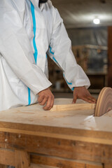 professional occupation, sanding wood with detail of hands