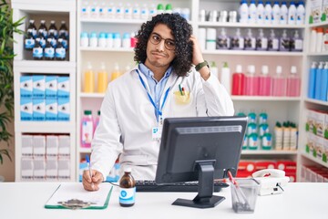 Hispanic man with curly hair working at pharmacy drugstore confuse and wondering about question....