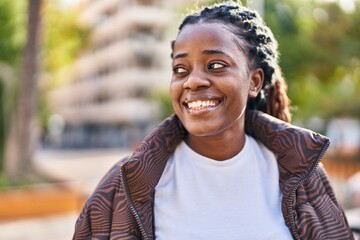 African american woman smiling confident looking to the side at park