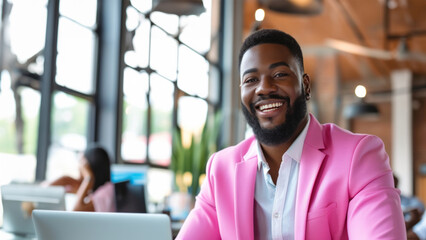 Fashion profile portrait of stylish african man with fashionable pink jacket on office background. Portrait of a handsome man in a pink jacket. Smiling black man stares at camera