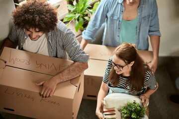 Diverse group of young people moving into a dorm together