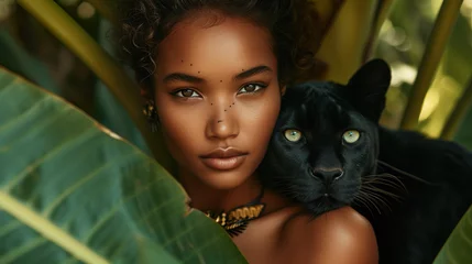Fotobehang Beautiful tanned woman with a puma in a tropical forest. © Robert