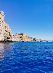 Fototapeta na wymiar General landscape, in Lindos, Greece. Turquoise Mediterranean Sea and rocks.