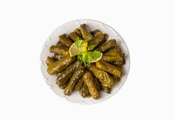 Delicious dolma (sarma) stuffed grape leaves rice. Lebanese dolma sarma on plate. Lebanon turkish greek middle eastern cuisine. (Turkish name; Yaprak sarma)