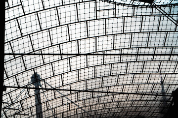 silhouette of a roof over a Munich Olympic Stadium  - obrazy, fototapety, plakaty