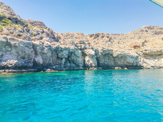 General landscape, in Lindos, Greece. Turquoise Mediterranean Sea and rocks. - obrazy, fototapety, plakaty