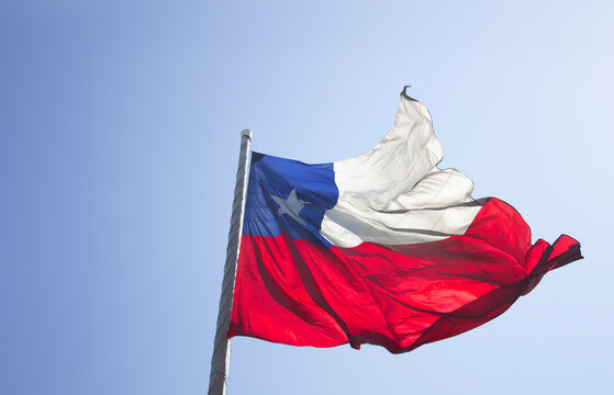 Flag of Chile on the wind, with copy space