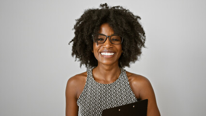 African american woman business worker holding clipboard smiling over isolated white background - obrazy, fototapety, plakaty