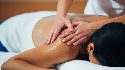 Body massage treatment. Man having massage in the spa salon. Masseur working on his back.