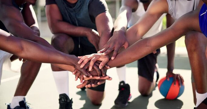 Hands, huddle or people with motivation on basketball court for planning mission, tactics or support. Training game, teamwork or closeup of athletes for solidarity, fitness or workout in sports match