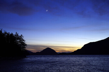 Naklejka na ściany i meble Howe Sound at dusk in winter with a crescent moon high in the sky