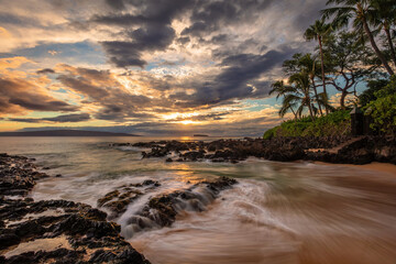 Maui's Secret Pa'ako Cove at sunset with a dramatic sky