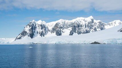 Fototapeta na wymiar Antarctica mountains and sea. South Pole. On a sunny day. 