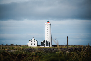 Fototapeta na wymiar Grotta lighthouse on coast of Iceland near Reykjavik. Seascape, travel landmark. Copy space banner