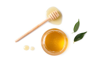 Tasty honey in glass jar, leaves and dipper on white background, flat lay