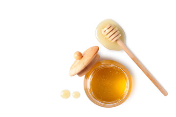 Tasty honey in glass jar and dipper on white background, top view. Space for text