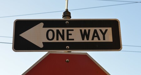 one way sign on the street against the sky DSLR photo