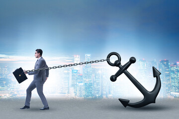 Businessman with anchor in business concept