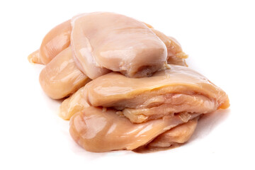 a pile of skinless and boneless chicken breasts isolated on white