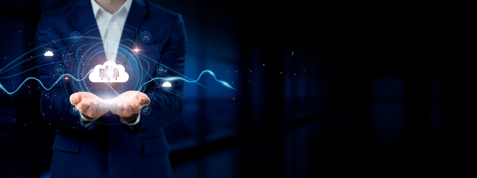 Businessman holding virtual Cloud Computing network connection icons. Data Storage, Scalability, Accessibility. Internet business and social network."