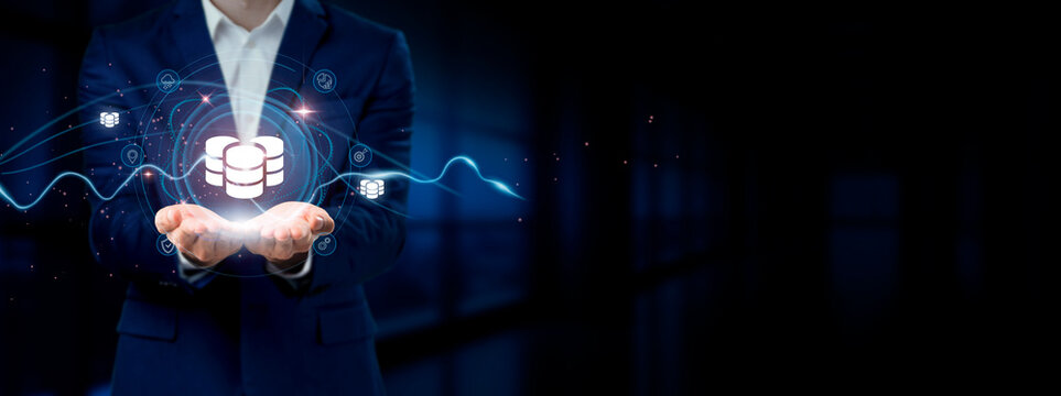 Businessman holding virtual Database and Network Connection icons. Data Integration, Analytics, Scalable Solutions for Internet Business and Social Network.