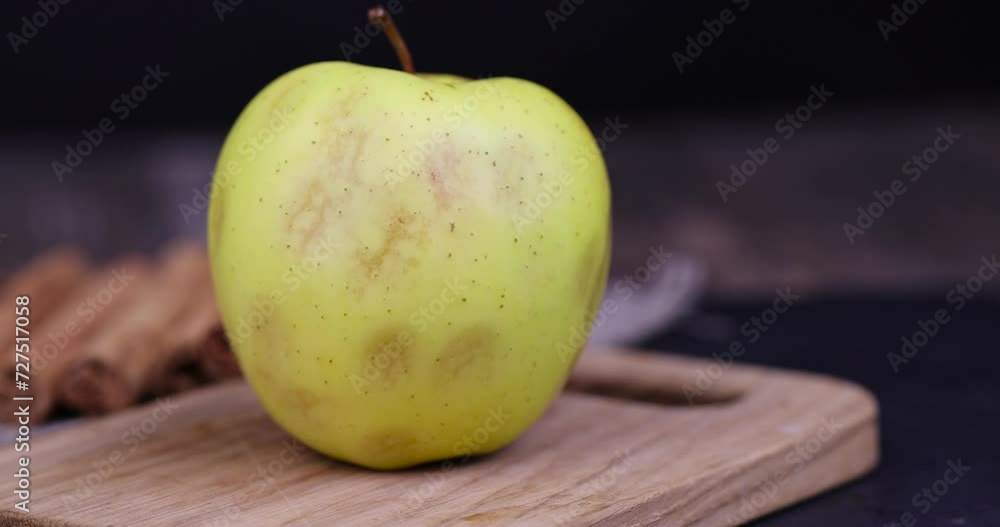 Sticker ripe yellow apple with cinnamon on the table, natural ingredients for cooking - Stickers