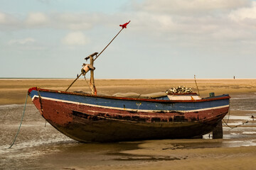 Fototapeta premium Photo of a rustic, traditional artisanal fishing boat in the state of Maranhão, Brazil, with the background blurred.