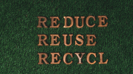 Fototapeta na wymiar Environmental awareness campaign showcase arranged recycle message in on biophilic green grass background. Environmental social governance concept idea for sustainable and greener future. Gyre