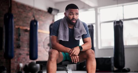 Gym, break and tired man with towel, pause or breathing for recovery from intense performance. Sports, burnout or male athlete sweating from physical challenge, workout or training, fatigue or rest - Powered by Adobe