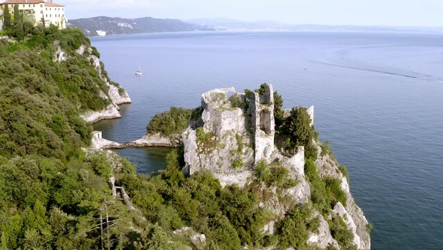 drone view of the old duino's castle near to the sea in trieste