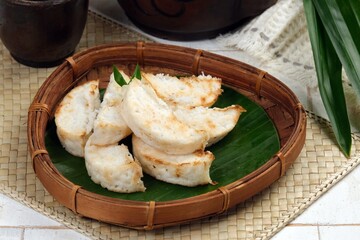 Kue Pancong or kue Gandos or Bandros cake is an Indonesian traditional snack made from a mixture of...