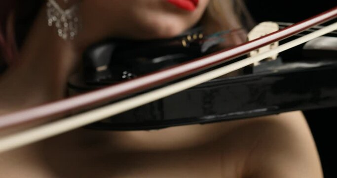 Violin performance highlighted by horizontal panorama