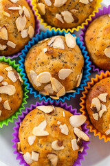 Lemon poppy seed muffins garnished with almond slivers