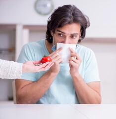 Young man suffering from allergy